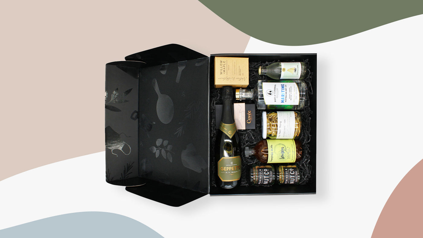 Selection of hamper ingredients in a black signature box 